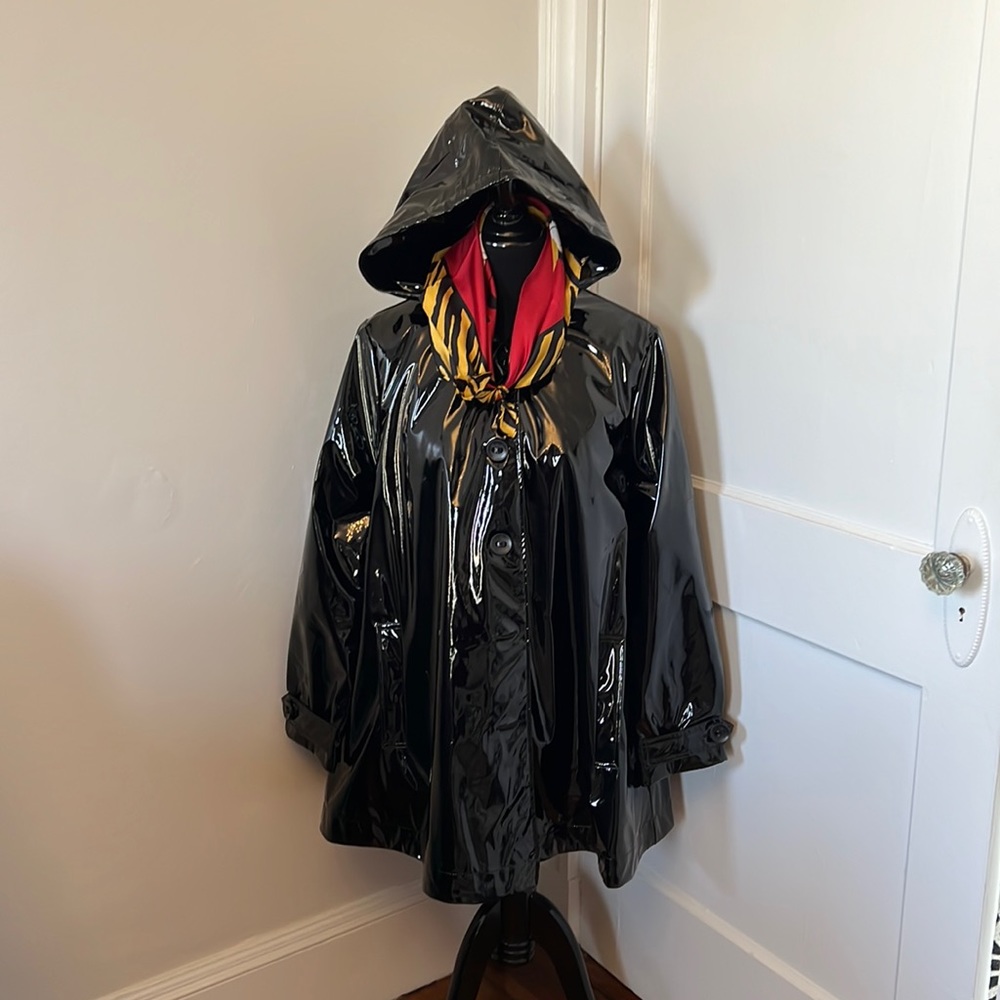Rain Coat.Black patent swing rain coat with detachable liner and hood.